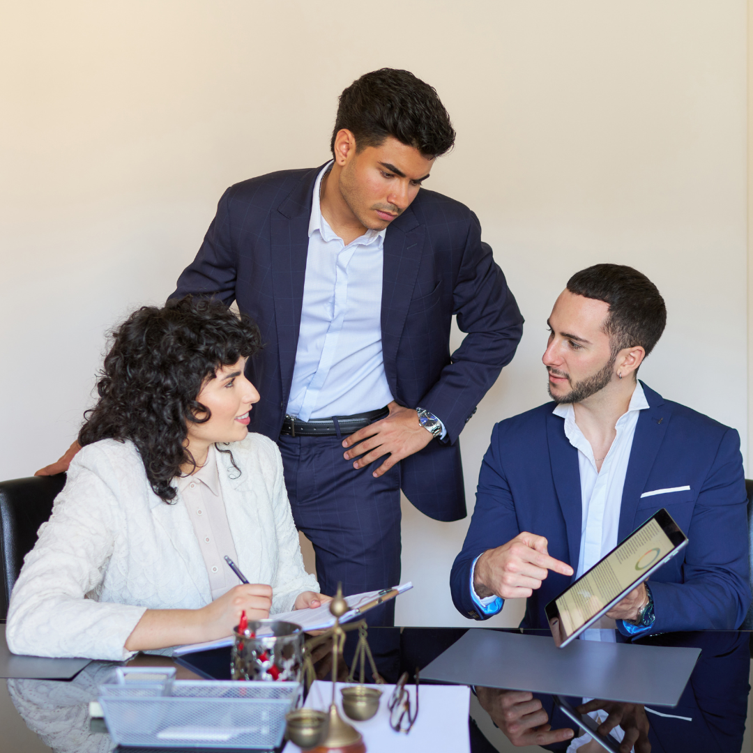 Three paralegals working together