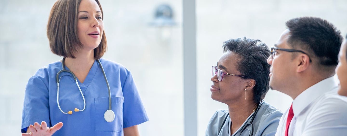 Medical trainer presenting to professionals