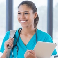 Medical student in scrubs with a backpack